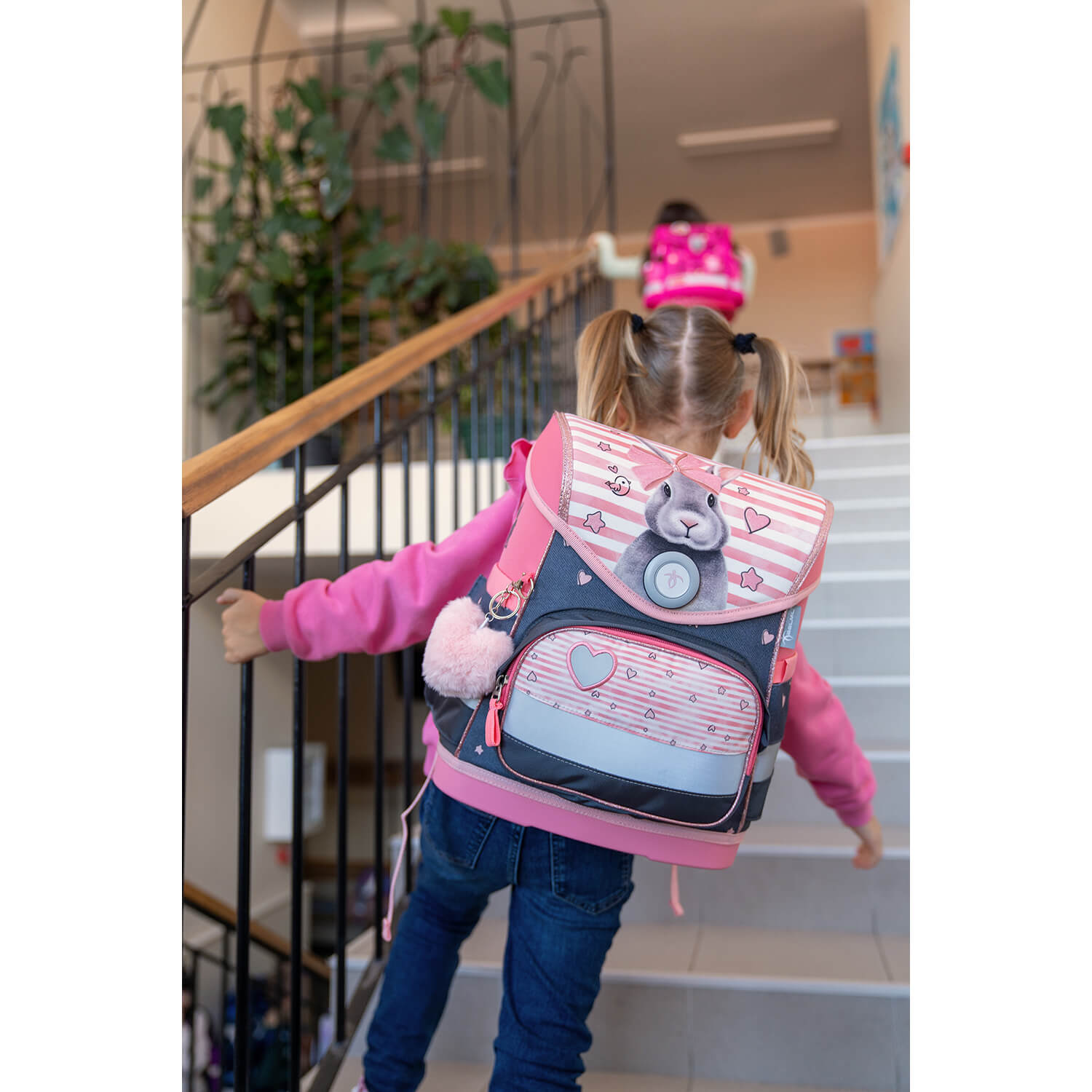 Belmil Compact Ergonomic School Bag Set 'Little Bunnies' Design + Unicorn Raincoat – 5-Piece Set for Girls featuring the magical unicorn raincoat that expands to cover the backpack.