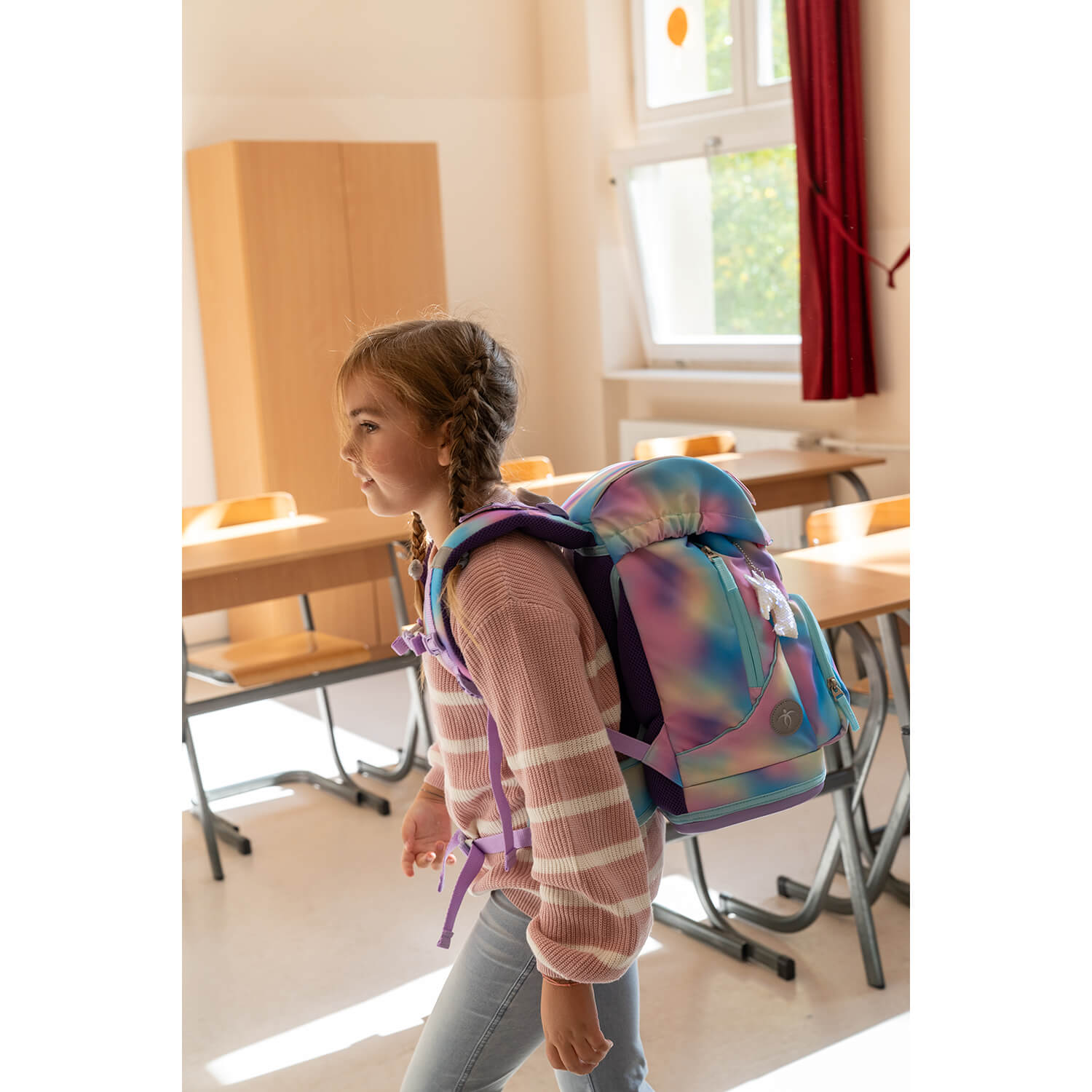 The front view of the Belmil Motion Rainbow Color Ergonomic School Bag Set – Made from Recycled Materials, 5 pcs, with 9 Interchangeable Patches featuring an insulated pocket for snacks.