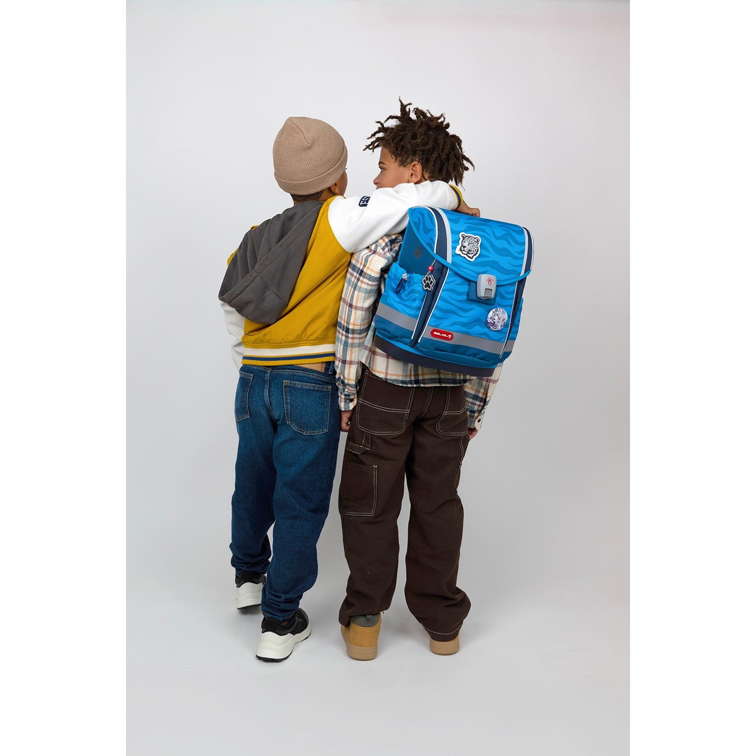 The stylish Belmil Classy Plus Animal Kingdom School Bag Set for Boys + Stone Age Patch Set (5 pcs) featuring a powerful wolf motif.