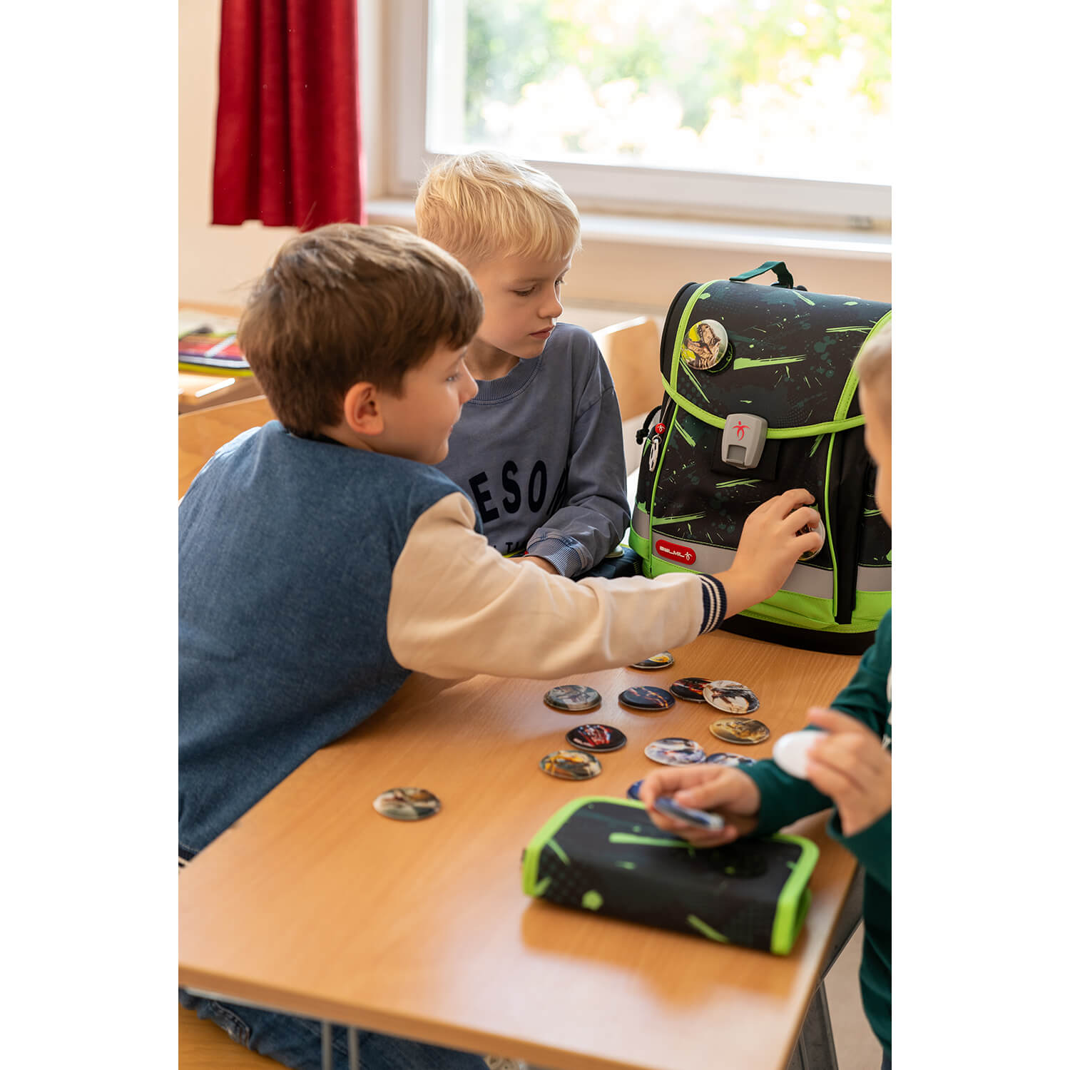 Explore the Belmil Classy Plus Ergonomic School Bag Set for Boys “Neon Sport” Design + Dinosaur Raincoat – 6-Piece Back-Friendly Starter Set with adjustable straps and ergonomic design.