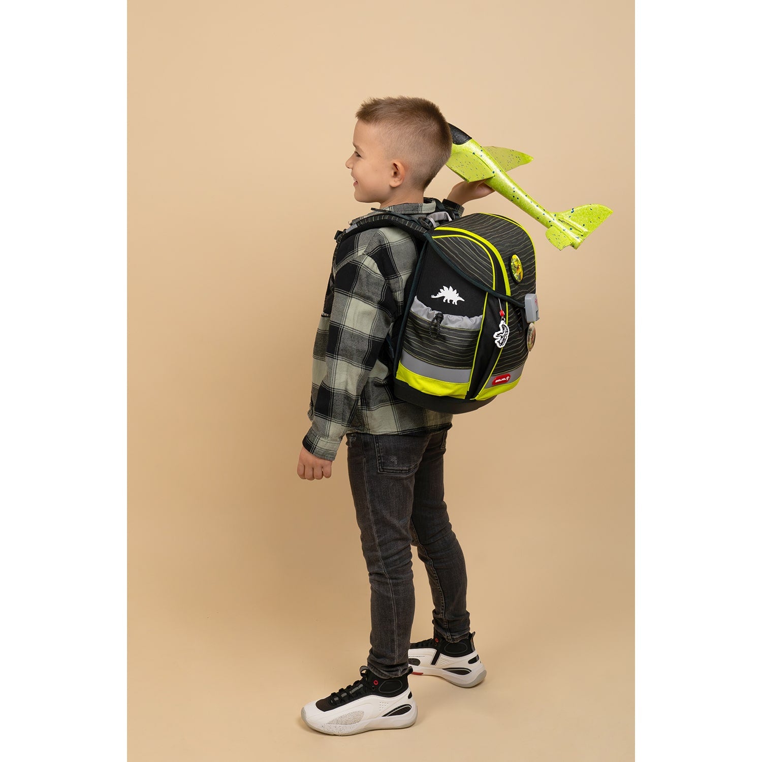 Close-up of the Belmil Classy Plus Prehistoric Times School Bag Set for Boys + Lost World Patch Set (5 pcs) with the Fidlock magnetic buckle.