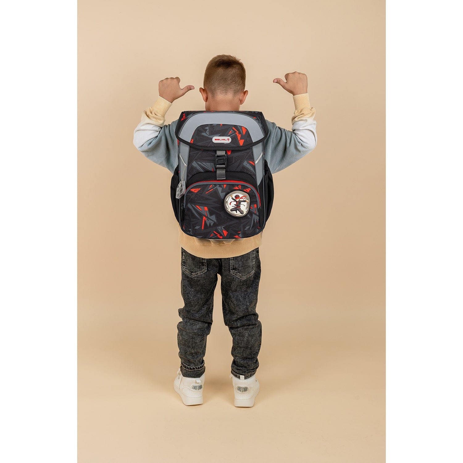 Child wearing the Maxi Ninja Game schoolbag, illustrating the comfortable fit and design of the Ergonomic School Bag Set for Boys – Belmil Maxi Ninja Game schoolbag set 5 pcs.